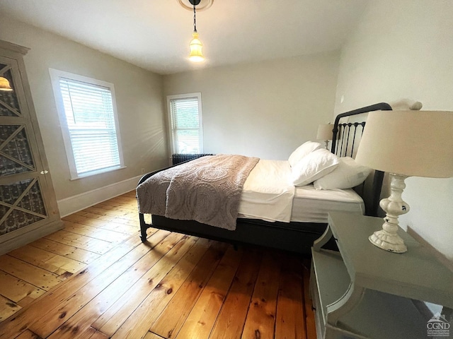 bedroom with hardwood / wood-style floors