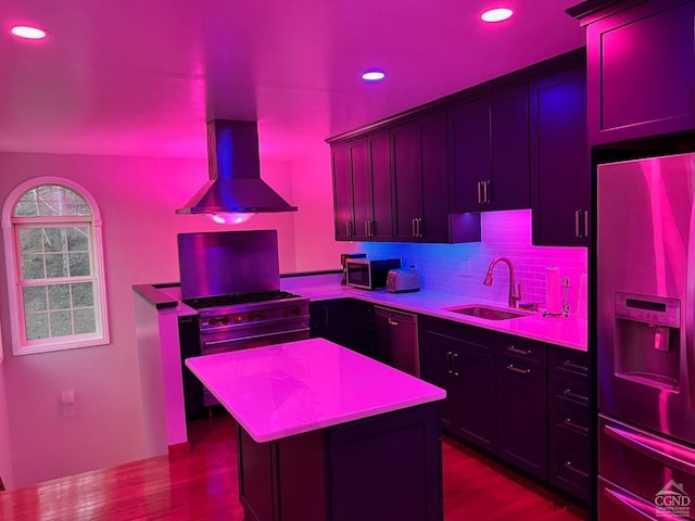 kitchen featuring sink, wall chimney exhaust hood, backsplash, black appliances, and light wood-type flooring