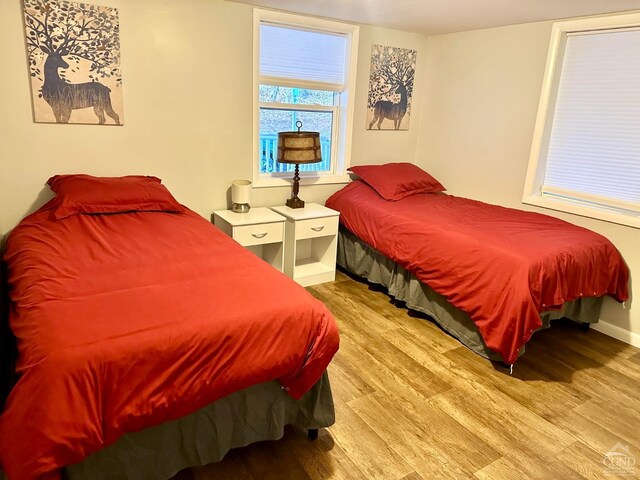 bedroom with light hardwood / wood-style floors