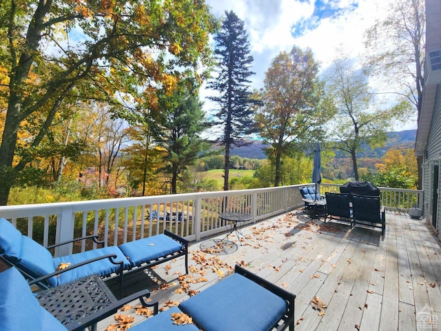 wooden deck featuring a mountain view