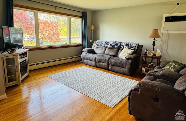 living room with a baseboard radiator and light hardwood / wood-style floors