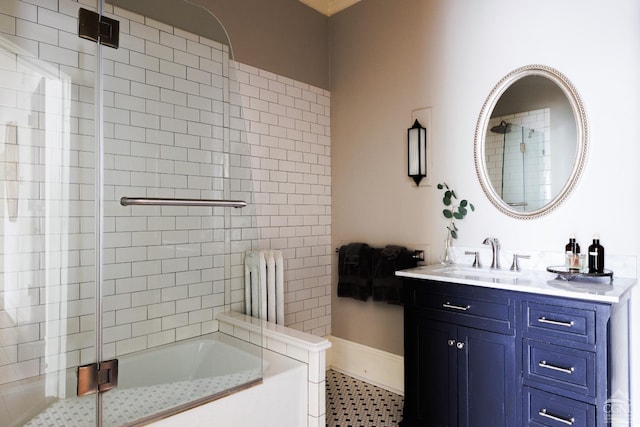 full bath with radiator, combined bath / shower with glass door, and vanity