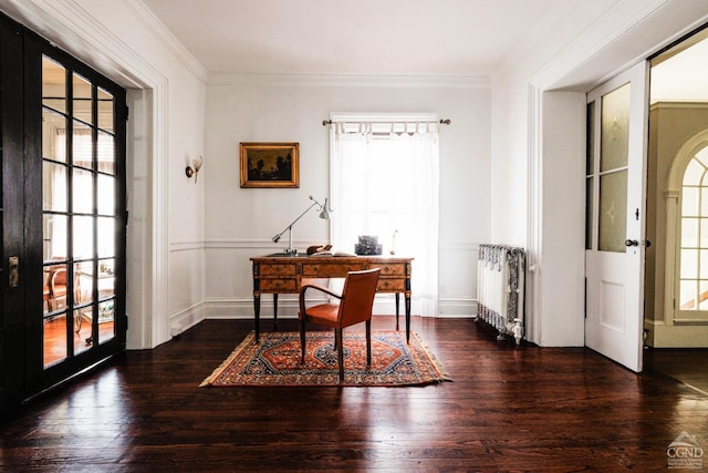 home office featuring ornamental molding, radiator heating unit, and wood-type flooring