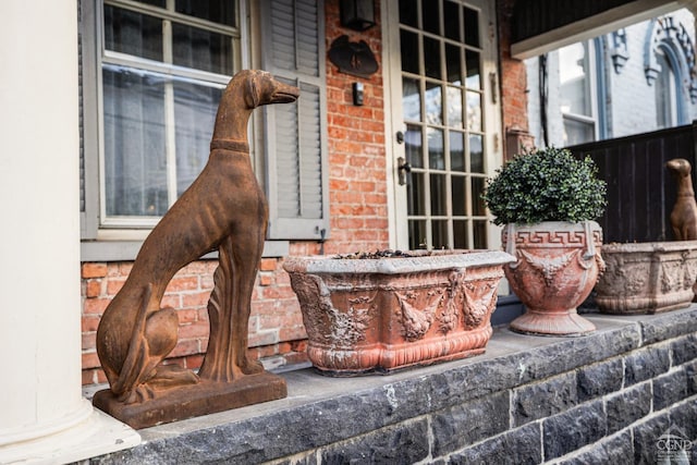 exterior details featuring brick siding