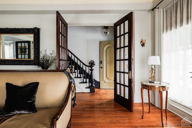 entryway with stairs and wood finished floors