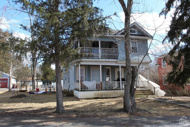 view of front of house with a porch and a balcony