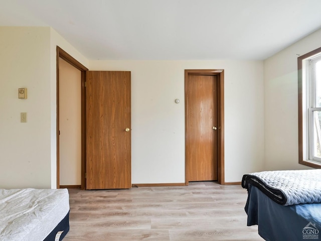 bedroom featuring light wood-type flooring