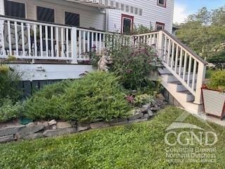 view of yard featuring stairway and a wooden deck