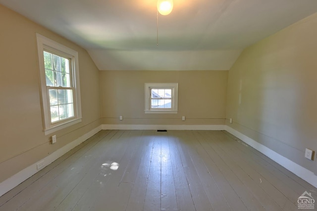 bonus room featuring light hardwood / wood-style flooring and lofted ceiling