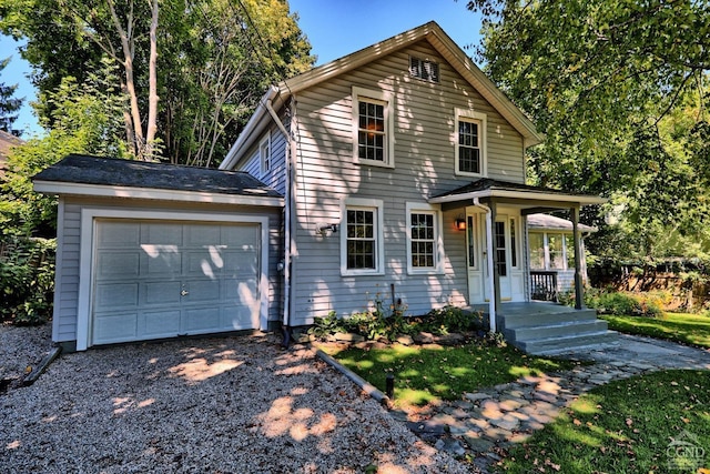 view of front facade with covered porch and a garage