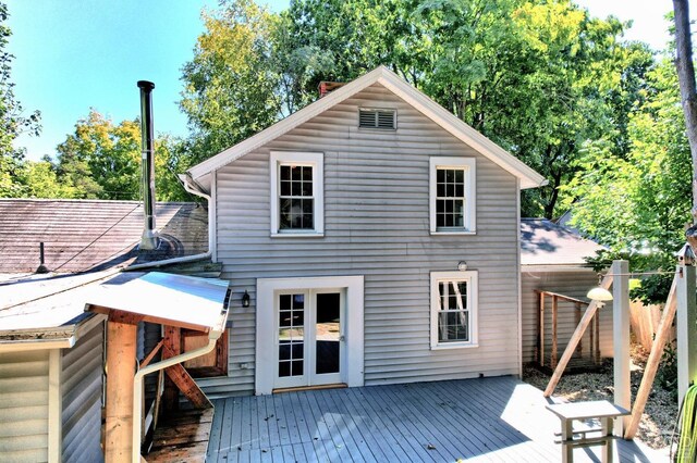 rear view of house with a wooden deck