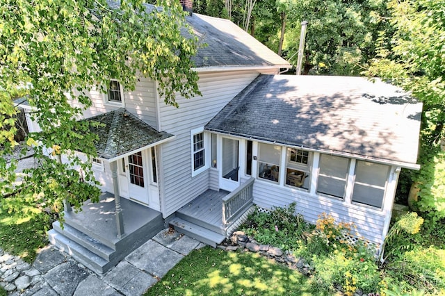 view of front of property with a deck and a sunroom