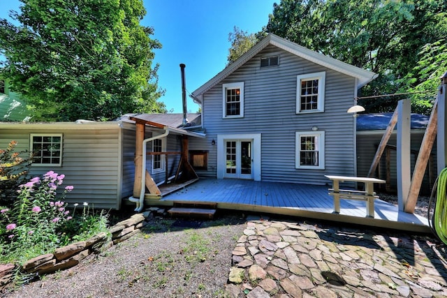 back of property with french doors and a deck