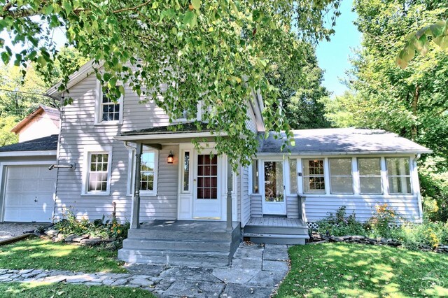 view of front of home with a garage and a front yard