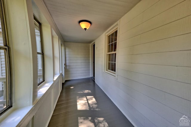 unfurnished sunroom featuring wooden ceiling