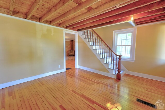 basement featuring hardwood / wood-style flooring and wooden ceiling