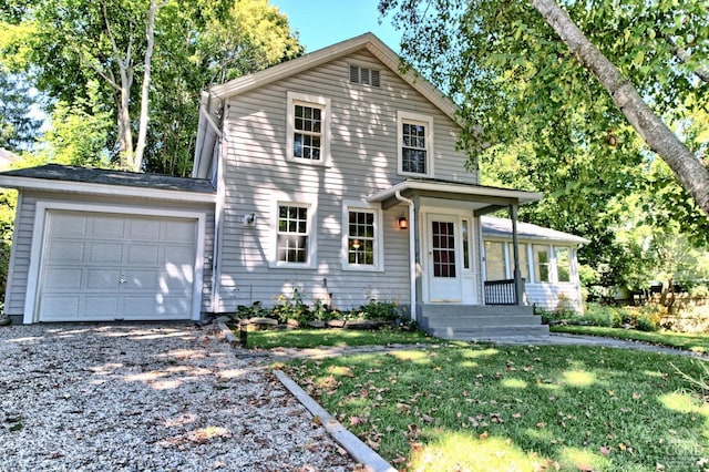 front facade with a front lawn and a garage