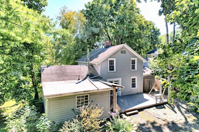 rear view of house featuring a deck