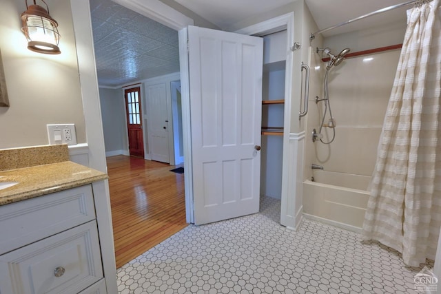 bathroom featuring vanity, shower / tub combo, and hardwood / wood-style flooring