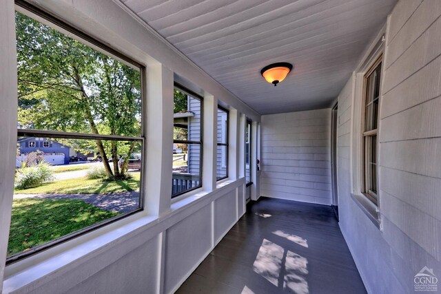 unfurnished sunroom featuring plenty of natural light