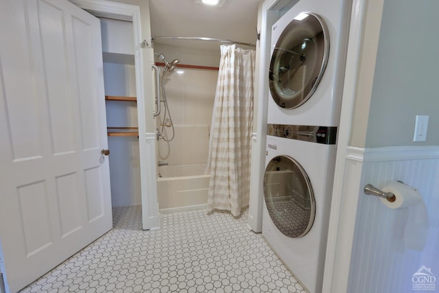 washroom featuring stacked washing maching and dryer