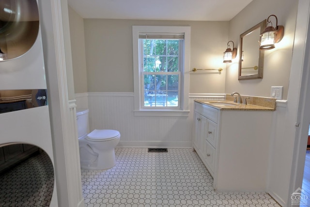 bathroom with vanity and toilet