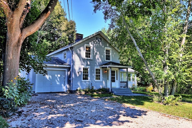 view of front facade with a porch and a garage