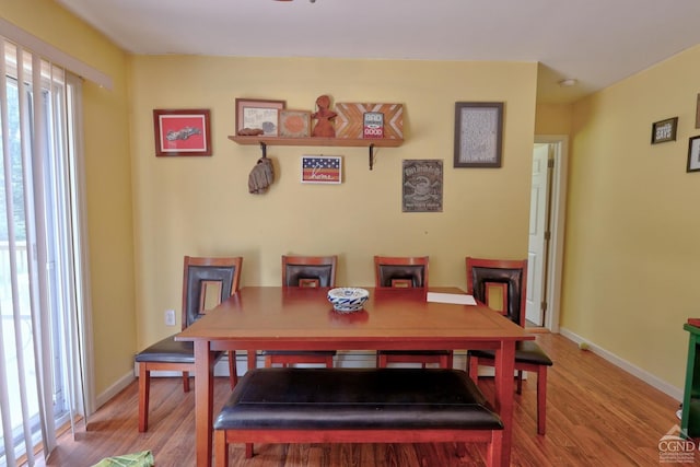 dining space featuring hardwood / wood-style flooring