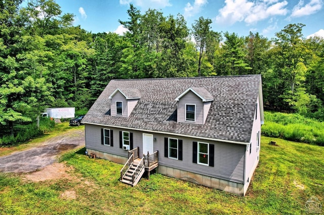 cape cod-style house with a front lawn