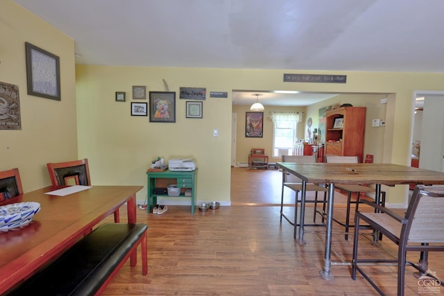 dining area featuring wood-type flooring