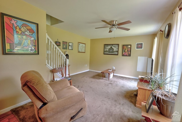 living area featuring ceiling fan and carpet floors