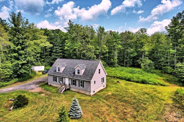 new england style home with a front lawn