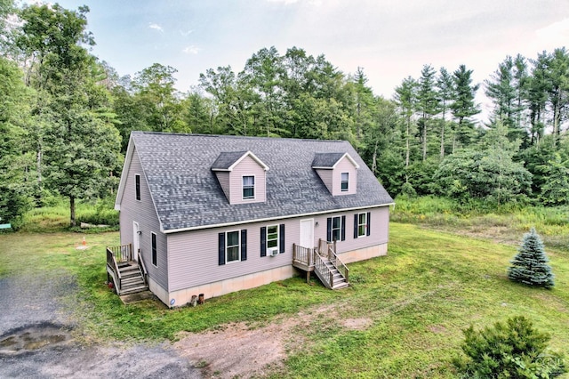 cape cod house featuring a front lawn