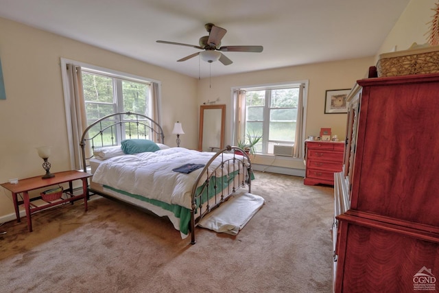 bedroom with multiple windows, ceiling fan, and light colored carpet