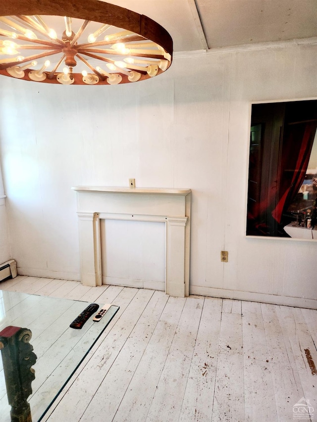 interior space featuring wood-type flooring, baseboard heating, and an inviting chandelier