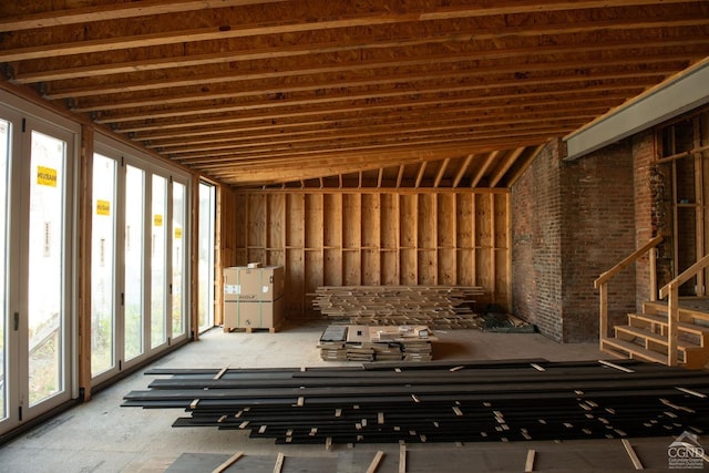 misc room featuring plenty of natural light and lofted ceiling