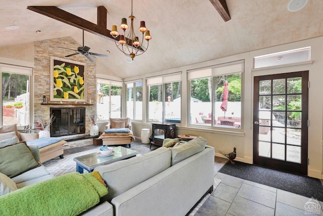 tiled living room featuring beam ceiling, a fireplace, high vaulted ceiling, and ceiling fan with notable chandelier