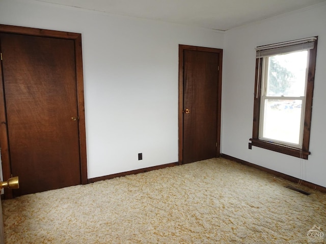 unfurnished bedroom with carpet floors