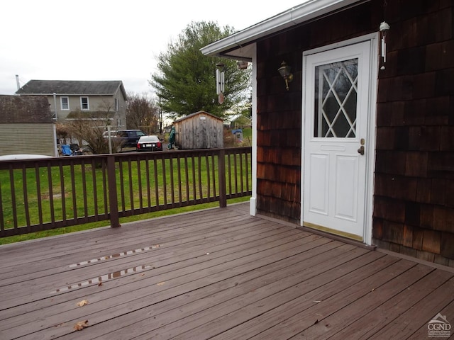 wooden deck with a yard