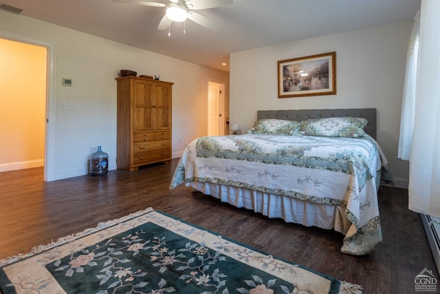 bedroom featuring ceiling fan and dark hardwood / wood-style flooring