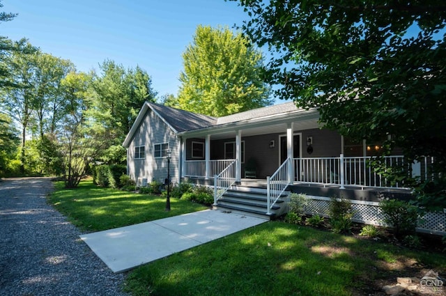 view of front of house featuring a front lawn and a porch