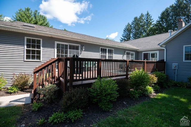 back of house featuring a wooden deck