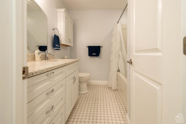 full bathroom featuring toilet, vanity, and shower / bath combo with shower curtain