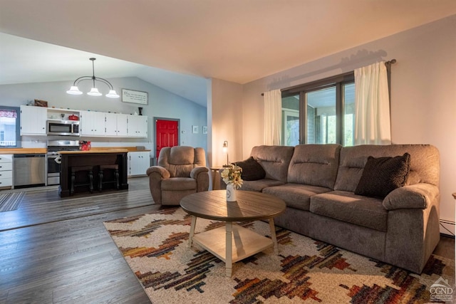 living room with baseboard heating, an inviting chandelier, dark hardwood / wood-style floors, and lofted ceiling