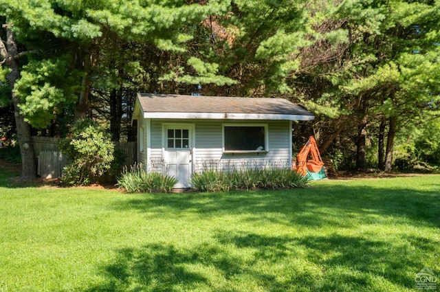 view of outdoor structure featuring a yard