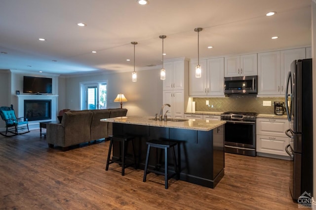 kitchen featuring white cabinetry, sink, and stainless steel appliances