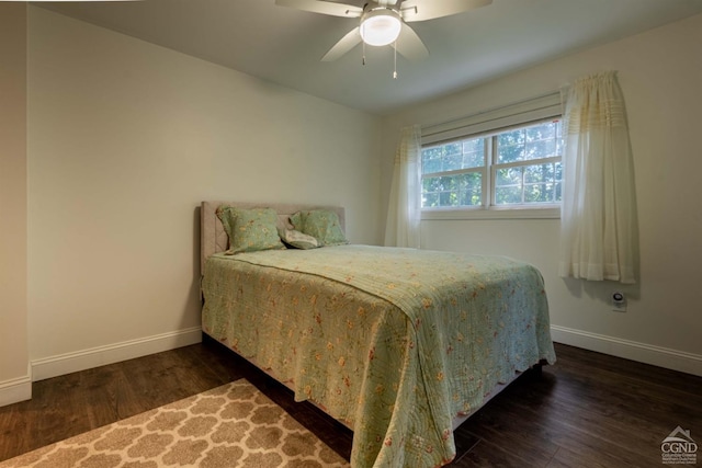 bedroom featuring ceiling fan and dark hardwood / wood-style floors