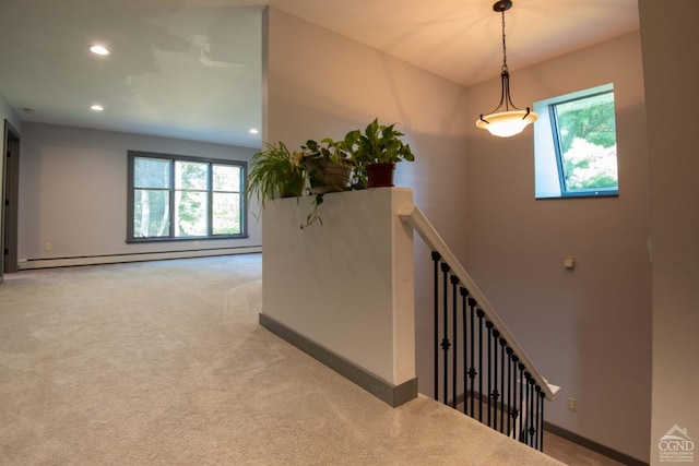 interior space featuring a baseboard radiator and carpet flooring