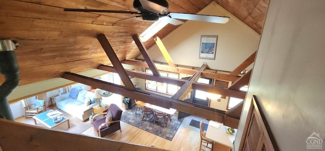 living room featuring vaulted ceiling, wood ceiling, and a ceiling fan