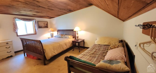 carpeted bedroom featuring lofted ceiling and wooden ceiling